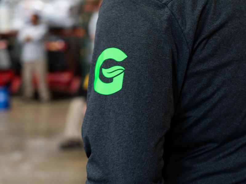 Green Group logo on a shirt